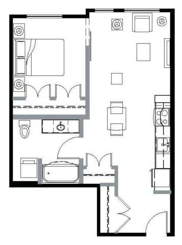 Floor plan of a one-bedroom apartment with an open-concept kitchen and living area, a bathroom, and a bedroom with double closet doors.